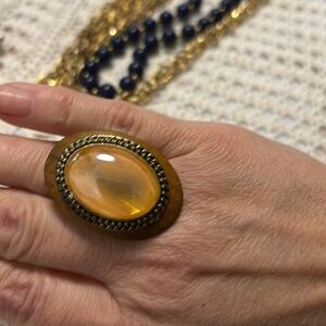 Large ornate oval ring in in browns beiges adjustable